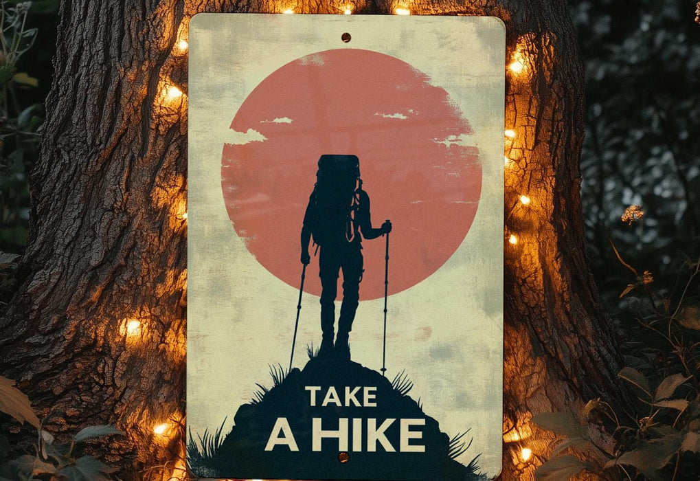 a sign that says take a hike on a tree