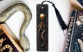 a bookmark, snake, and other books on a table