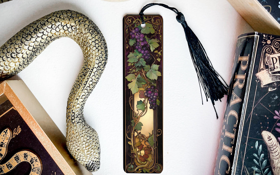 a bookmark with a snake and flowers on it