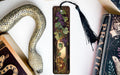 a bookmark with a snake and flowers on it