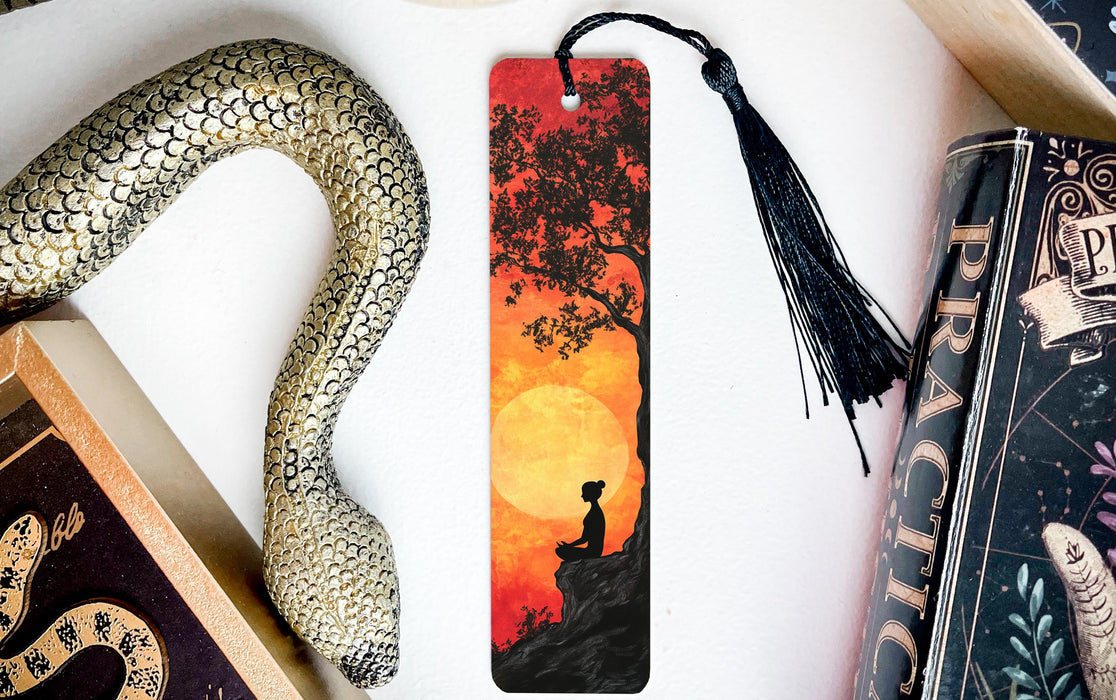 a bookmark with a picture of a man on a tree