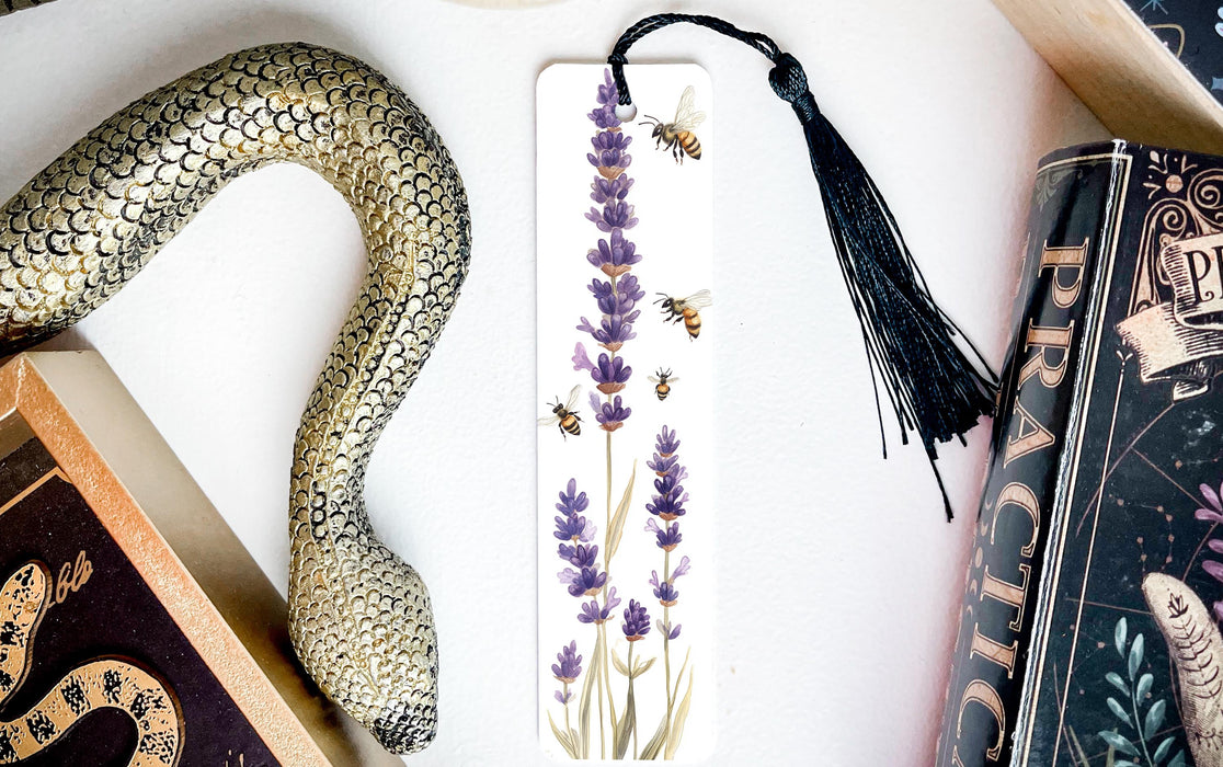 a bookmark with a snake and flowers on it