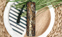 a close up of a plate with a bookmark