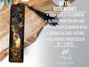a metal bookmark with grapes and leaves on it