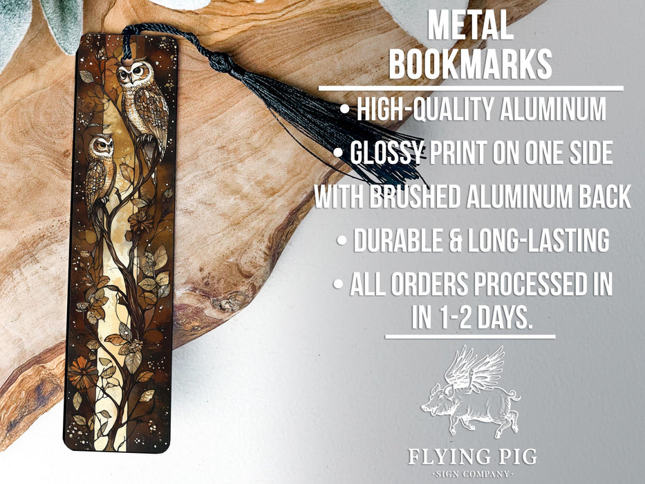 a metal bookmark with an owl design on it