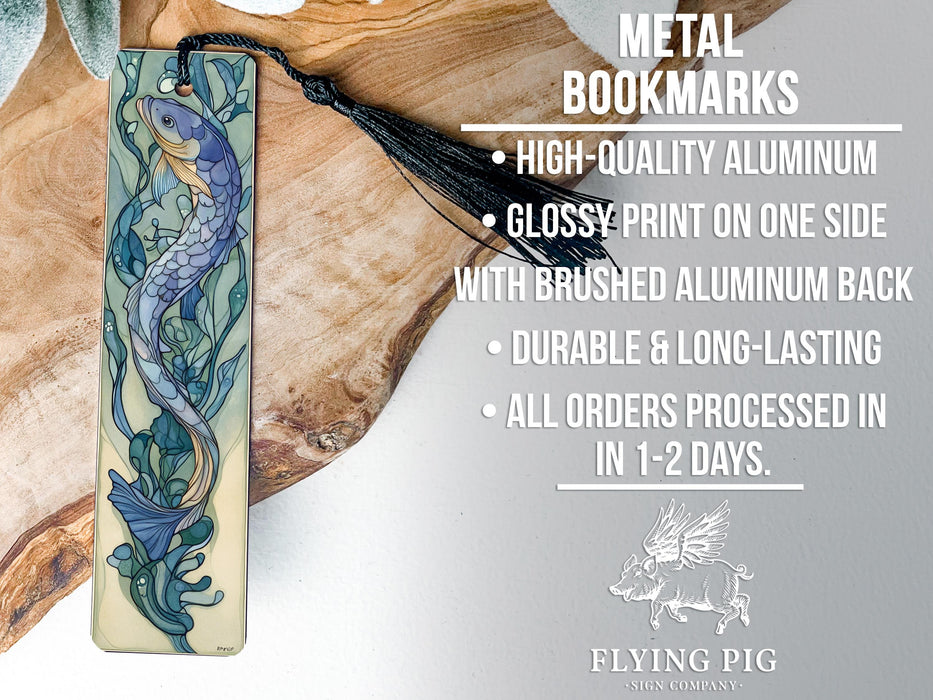a metal bookmark with a blue dragon on it