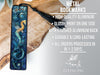 a metal bookmark with a dragon on it