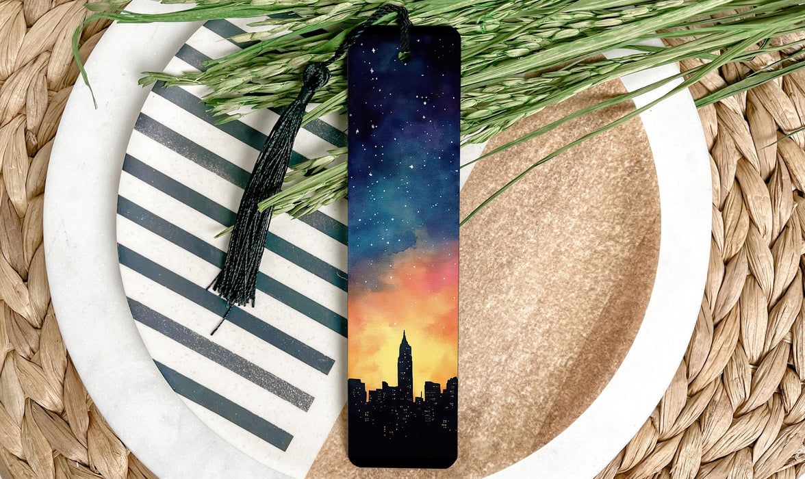 a bookmark with a picture of a city at sunset