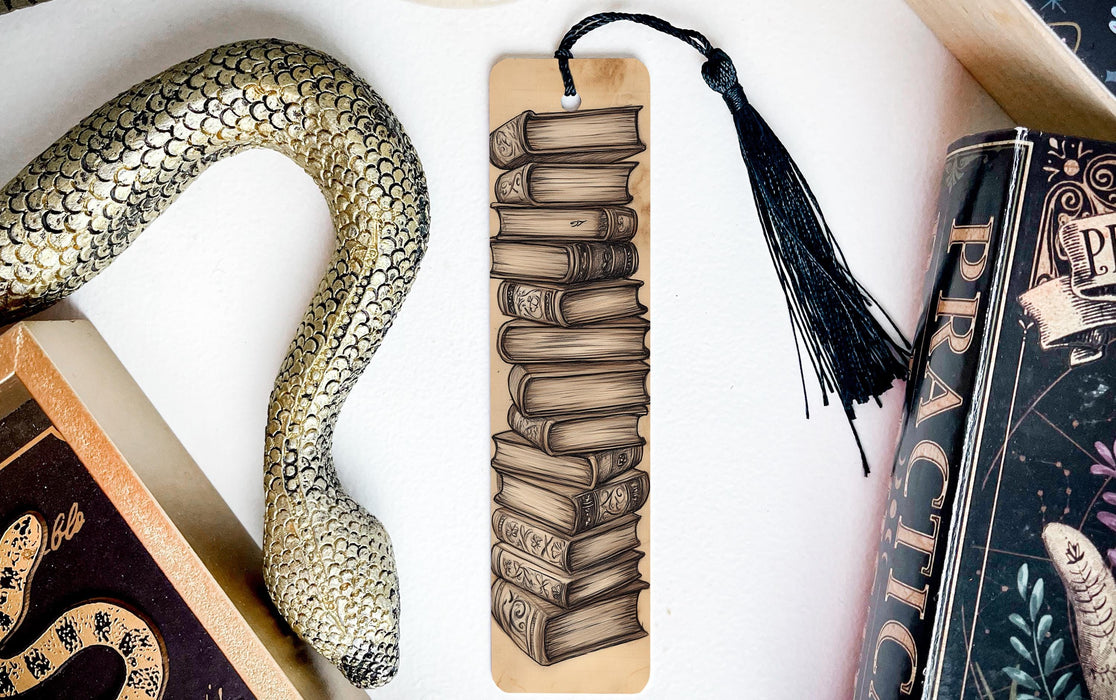 a bookmark with a snake and books on it