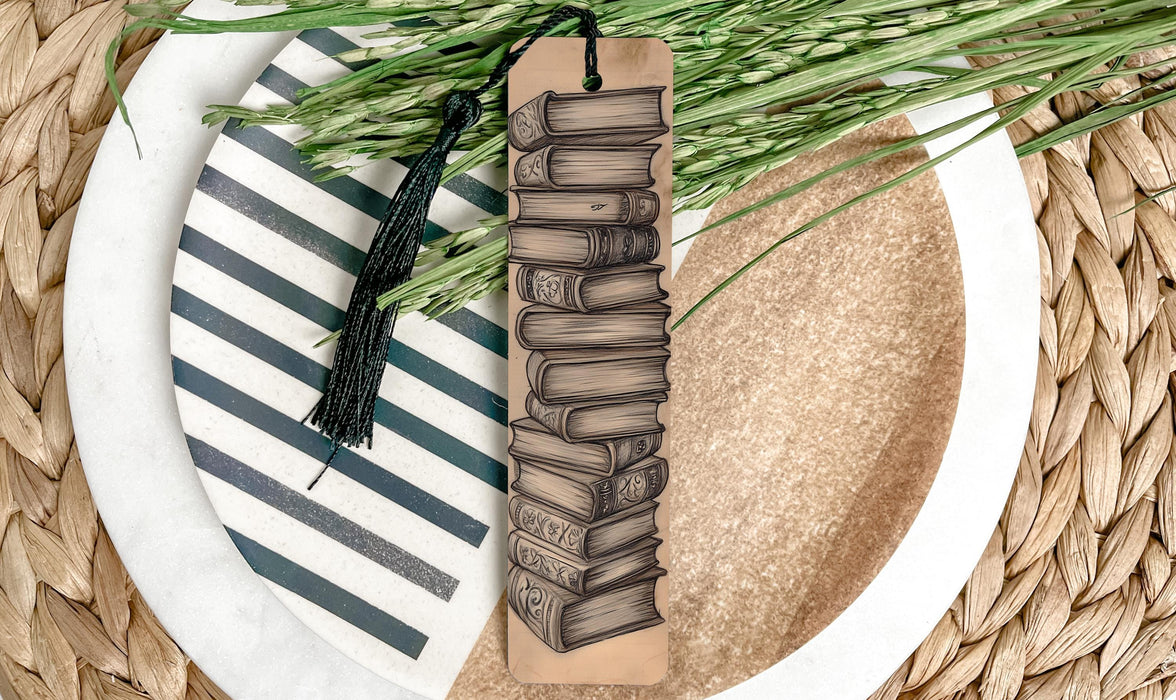 a bookmark on a plate with a green plant