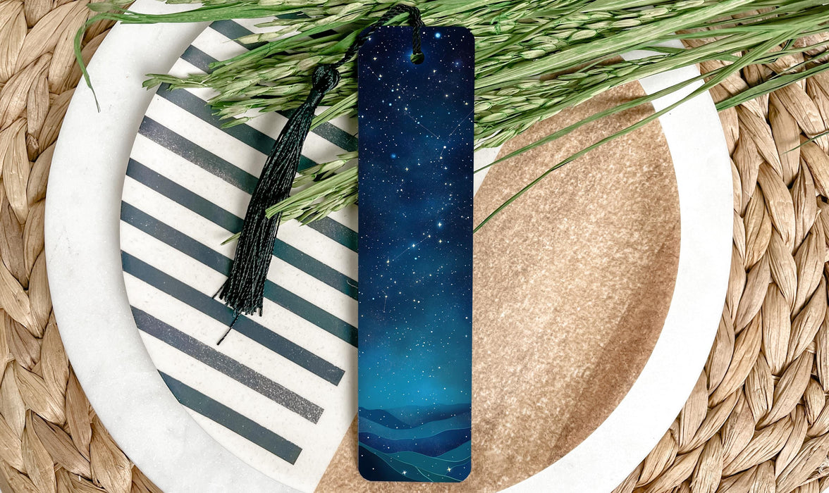 a blue bookmark sitting on top of a white plate