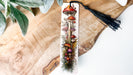 a bookmark with a tassel hanging from it