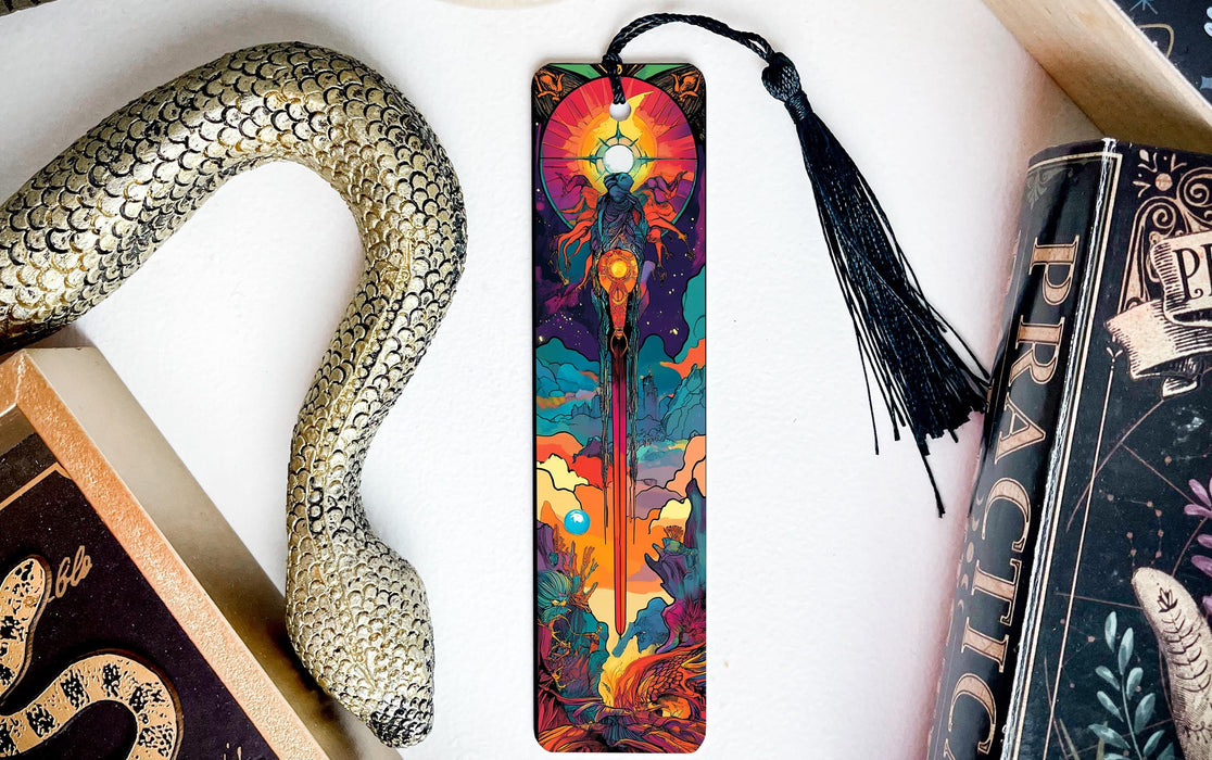 a bookmark, snake, and other books on a table