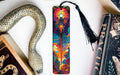 a bookmark, snake, and other books on a table