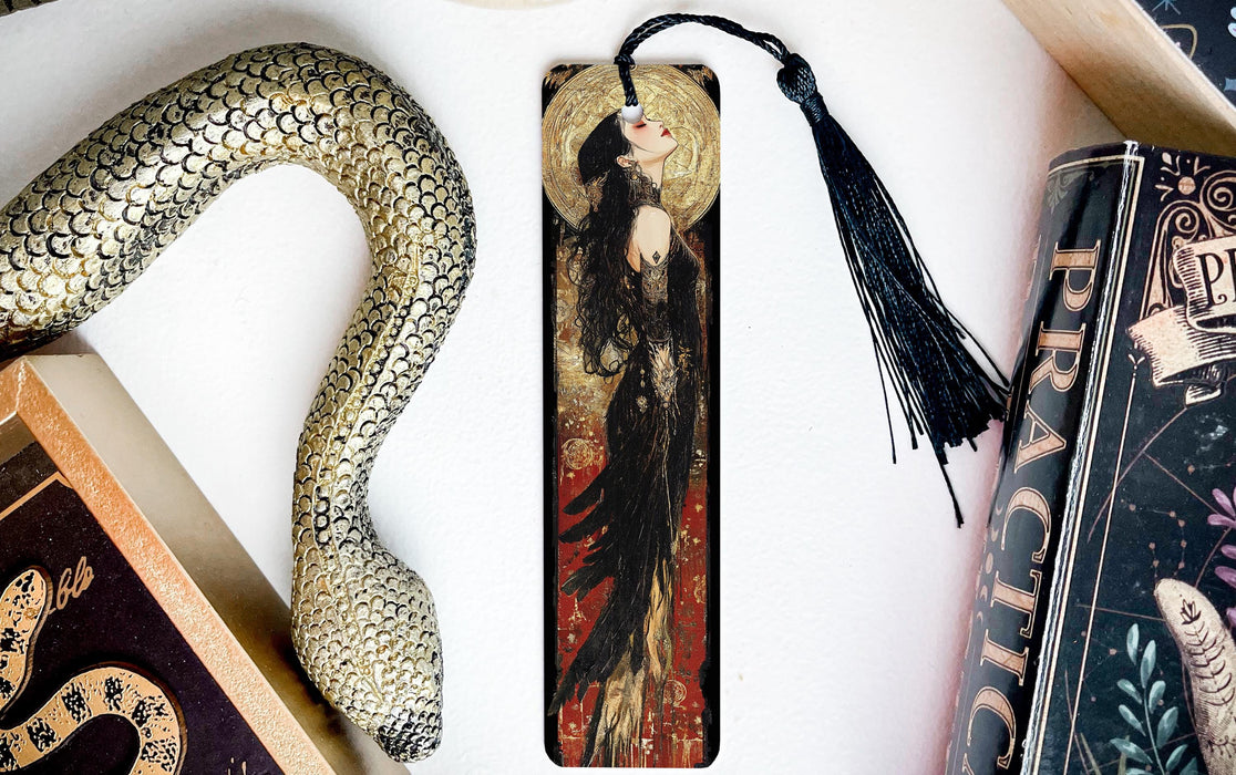 a bookmark with an image of a woman and a snake on it