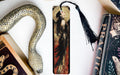a bookmark with an image of a woman and a snake on it