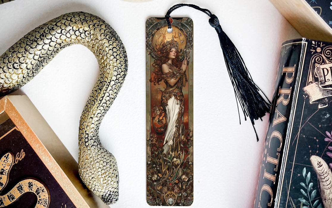 a bookmark with a picture of a woman and a snake on it