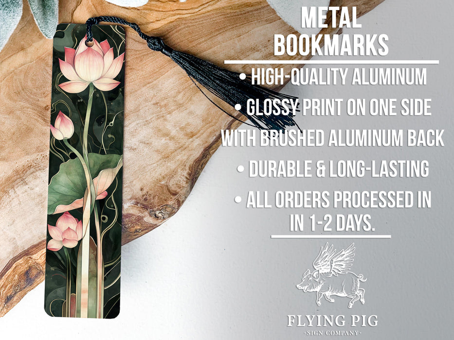 a metal bookmark with pink flowers on it