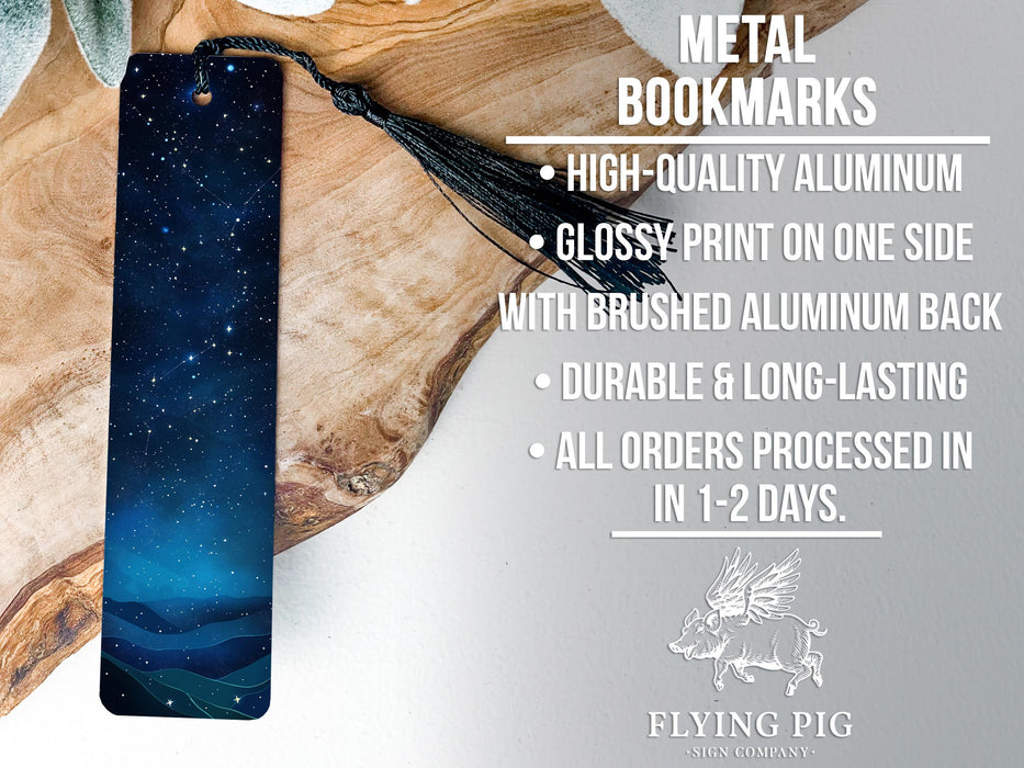 a metal bookmark with a blue tie on it