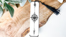 a bookmark with a tassel hanging from it
