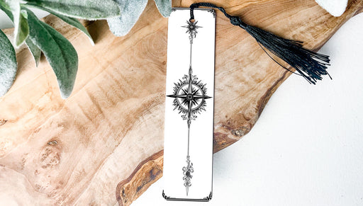 a bookmark with a tassel hanging from it