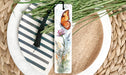 a bookmark with a picture of a butterfly on it