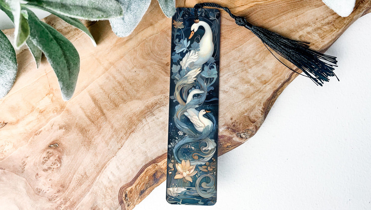 a black and white bookmark with a swan on it