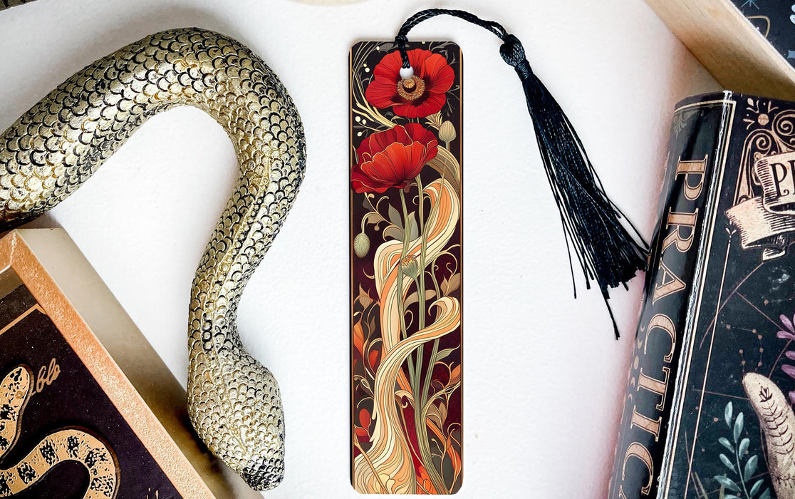 a snake, a bookmark, and some books on a table