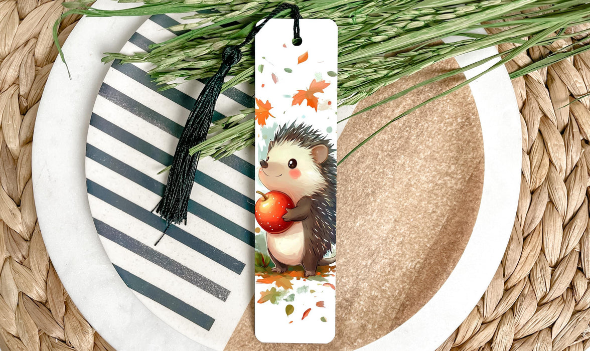 a bookmark with a hedge holding an apple