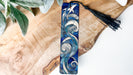 a wooden board with a blue and white design on it