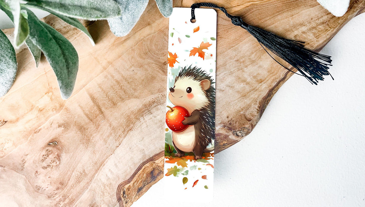 a bookmark with a hedge holding an apple