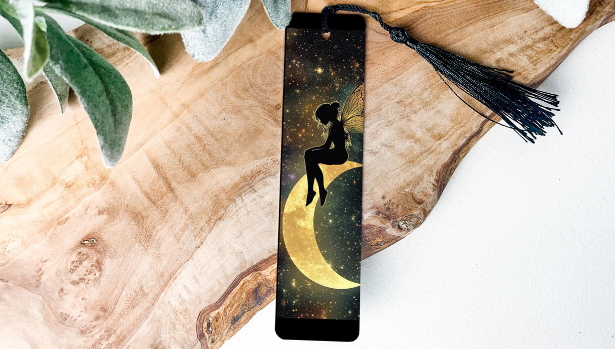 a bookmark with a picture of a girl sitting on the moon