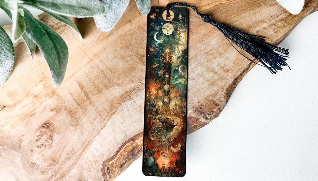 a bookmark with a tassel on top of a piece of wood
