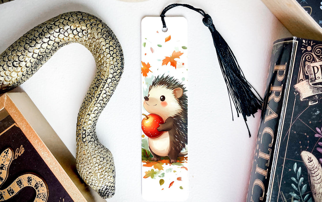 a bookmark with a hedge holding an apple