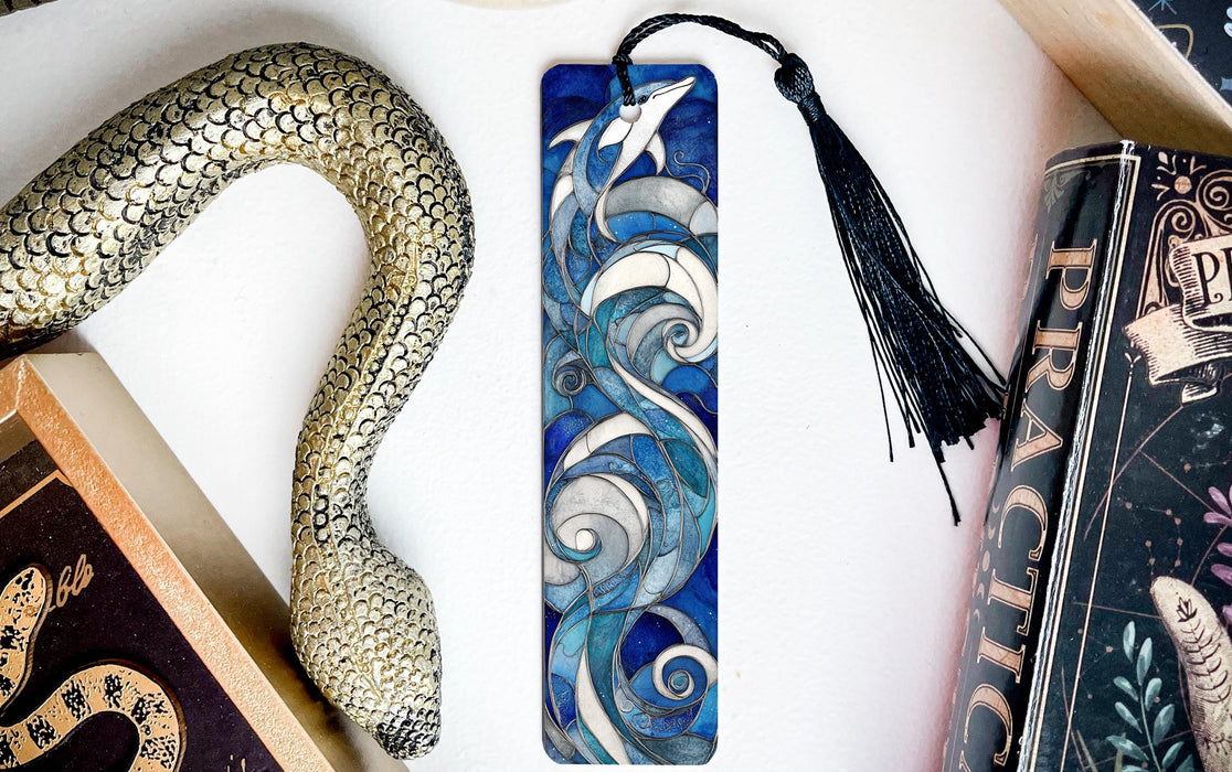 a collection of books and a snake on a table