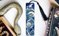 a collection of books and a snake on a table