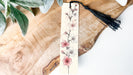 a bookmark with a floral design on it