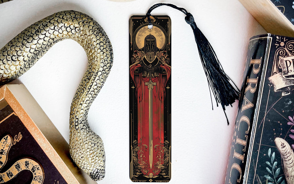 a bookmark, snake, and other items on a table