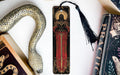 a bookmark, snake, and other items on a table