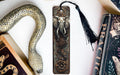 a bookmark with an elephant and a snake on it