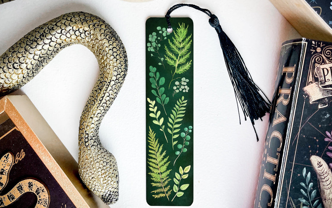 a snake, bookmarks, and other items on a table