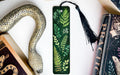 a snake, bookmarks, and other items on a table