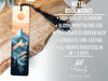 a bookmark with a mountain scene on it