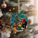 a christmas ornament hanging from a christmas tree