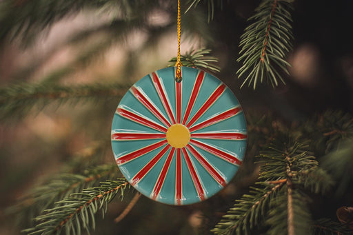 a christmas ornament hanging from a christmas tree