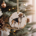 a dog ornament hanging from a christmas tree