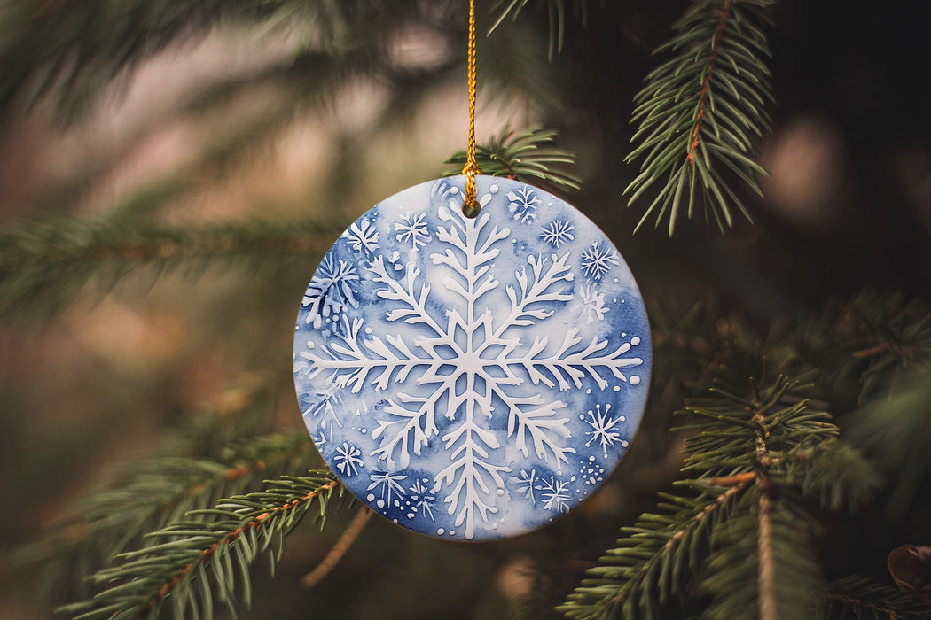 a snowflake ornament hanging from a christmas tree