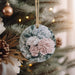 a close up of a christmas ornament on a tree