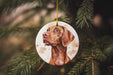 a brown dog ornament hanging from a christmas tree