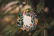 a christmas ornament hanging from a tree